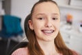 Portrait of smiling child with braces in dentist`s office