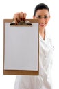 Front view of smiling doctor showing writing pad Royalty Free Stock Photo