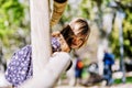 Front view of a smiling little girl looking camera in the park in a sunny day Royalty Free Stock Photo