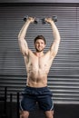 Front view of smiling man lifting weight Royalty Free Stock Photo