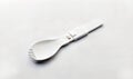 front view of 2 in 1 split plastic spoon and fork utensil isolated on white background Royalty Free Stock Photo