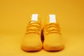 Front view of sport yellow pair shoes Royalty Free Stock Photo