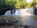 Front view, Sri Dit Waterfall is a small and forested one level waterfall with sunlight at Khao Kho, Phetchabun Province, Thailand Royalty Free Stock Photo