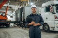 Front view, standing. Male worker is in the modern warehouse or manufacturing company Royalty Free Stock Photo