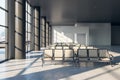 Front view on stylish airport seats in sunlit empty waiting area hall with big panoramic windows and concrete floor. Royalty Free Stock Photo