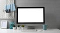 Stylish workspace with mock up computer and office supplies gadget. Blank screen for graphic display montage. Royalty Free Stock Photo