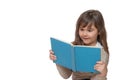 Front view of surprised little girl reading a book Royalty Free Stock Photo