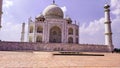 Front view Taj Mahal Tomb mausoleum with large pavilion in the foreground. It is a white marble of Mughal emperor Shah Jahan in