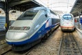 Front view of a TGV high speed train stationing next to an ICE bullet train in Paris Gare de l'Est station Royalty Free Stock Photo