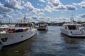 Front view of three luxury motorboats moored in the central parts of Stockholm Sweden