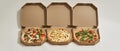 Front view of three variety pizzas in open boxes