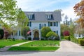 Front view of traditional colonial home with blue shutters Royalty Free Stock Photo