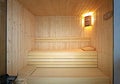 Front view of traditional Finnish sauna room. Empty interior of wooden spa cabin with hot dry steam Royalty Free Stock Photo