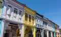 Front view of traditional vintage Singapore shop house or shophouse with antique red, blue and yellow wooden shutters in Royalty Free Stock Photo