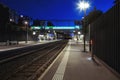 Front view train station in switzerland at night with no people. Illuminate the scene of modern street lamps