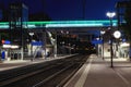 Front view train station in switzerland at night with no people. Illuminate the scene of modern street lamps