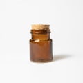 Front view of transparent empty brown glass jar bottle with closed cork cap lids on white background Royalty Free Stock Photo