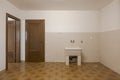 Front view tub and two doors, one open, one closed. Interior of empty old villa to be refurbished Royalty Free Stock Photo