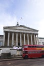 Front view of University College London main building with a double decker bus and beautiful sky Royalty Free Stock Photo