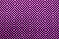 Front view of vibrant purple and black ethnic pattern fabric for background Royalty Free Stock Photo
