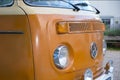 Front view of a vintage orange VW Volkswagen bus in color in Cologne, Germany