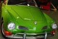 Front view of vintage sports car 2+2 coupe Volkswagen Karman Ghia from year 1962, bright green metallic colour