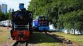 Front view of vintage steam train locomotive type GR and diesel locomotive TU7A. Narrow gauge Kyiv Children`s Railway Royalty Free Stock Photo