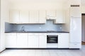 Front view white kitchen dated Royalty Free Stock Photo