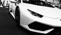 Front view of a White Luxury sport car Lamborghini Huracan LP 610-4. Car exterior details. Black and white Royalty Free Stock Photo