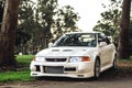 Front view of a white Mitsubishi Evolution VI