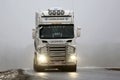 Front View of White Scania Truck in Fog Royalty Free Stock Photo