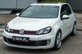 Front view of white Volkswagen Golf GTI MK6 parked in the street Royalty Free Stock Photo