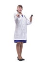 Front view of woman doctor looking at her smartphone while smiling Royalty Free Stock Photo