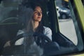Front view of woman that drives modern new car in the city Royalty Free Stock Photo