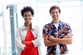 Business people with arms crossed looking at camera in a modern office Royalty Free Stock Photo