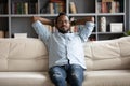 Young peaceful biracial man sleeping on comfortable sofa. Royalty Free Stock Photo