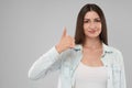 Smiling woman showing thumb up. Royalty Free Stock Photo