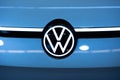 Front VW badge of blue Volkswagen electric car..