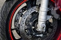Front wheel and braking mechanism of a biker motorcycle. Road safety