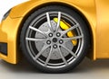 Front wheel of a bright yellow car Royalty Free Stock Photo