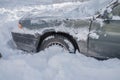 The front wheel of the car is stuck in a snowdrift. Snow drift Royalty Free Stock Photo
