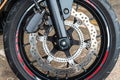 Front wheel close up of brakes system in a modern motorcycle modern Royalty Free Stock Photo