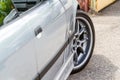 Front wheel and door of a gray car. Rear view of the car. Horizontal orientation. High quality photo Royalty Free Stock Photo