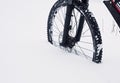 The front wheel of mountain bike stay in powder snow. Lost path Royalty Free Stock Photo