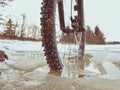 Front wheel of mtb blocked in ivy pool, extreme cycling in winter landscape. Broken ice floe Royalty Free Stock Photo