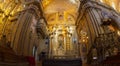 Front wide angle view of the altar of the Church of the Society of Jesus, known colloquially as la Compania, is a Jesuit church