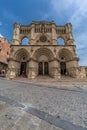 Front wide angle view of Cuenca Cathedral from stone pavimented street