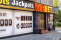 The front of a Winbet gambling hall entrance. Signage boards on front above the casino cadoor and instead of its windows. On a day