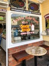 The front window of the Avalon Bake Shop on Catalina Island with colorful stenciling