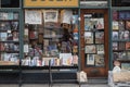 Front window of small antiquarian shop selling books